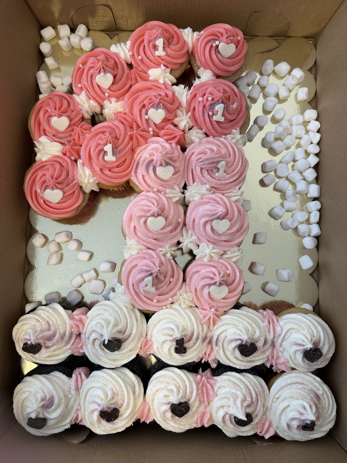 Pink first birthday cupcake arrangement by CakedByKim