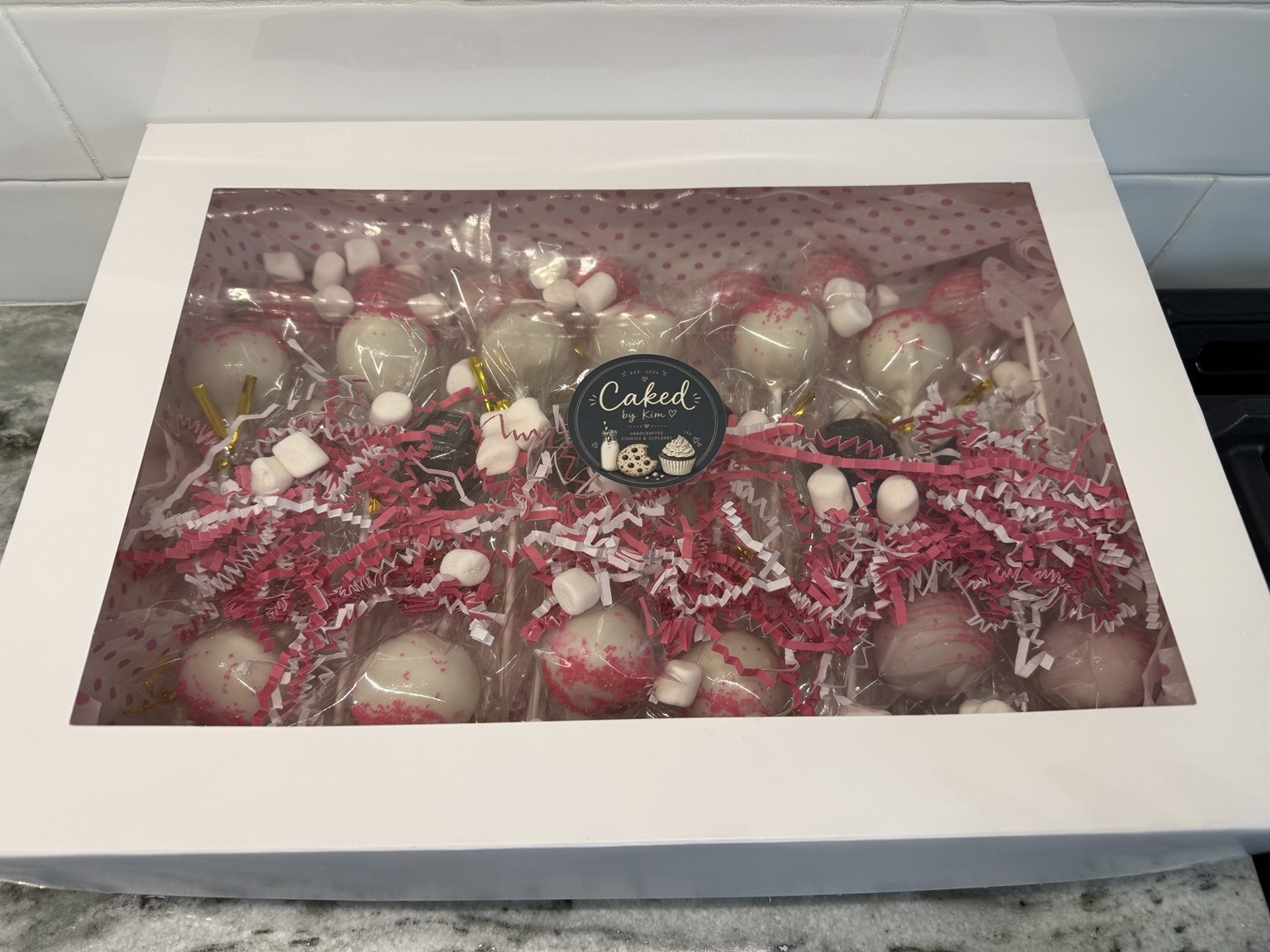 Boxed pink and white cake pop order by CakedByKim